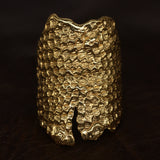 Bearded Dragon Armour Ring front shot, in 18 karat yellow gold. Lying on leather - CLIO SASKIA